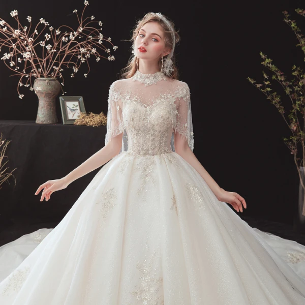Vintage / Retro Champagne See-through Bridal Wedding Dresses With Shawl 2020 Ball Gown High Neck Sleeveless Backless Glitter Tulle Flower Appliques Lace Beading Cathedral Train Ruffle