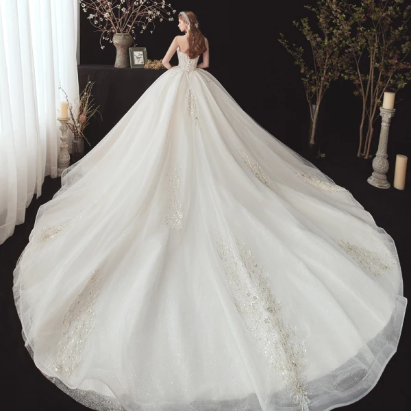 Chic / Beautiful Champagne Bridal Wedding Dresses 2020 Ball Gown Strapless Sleeveless Backless Appliques Sequins Beading Glitter Tulle Cathedral Train Ruffle