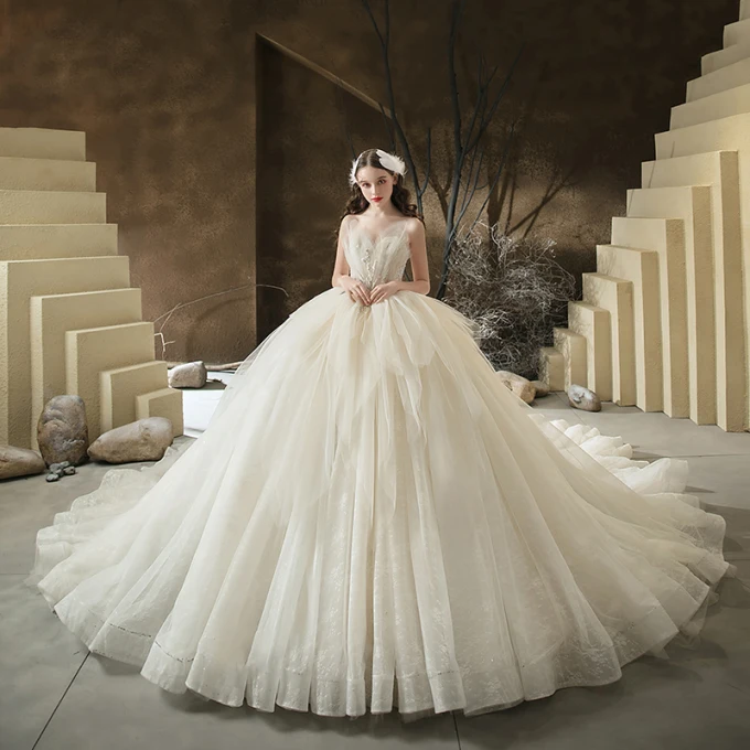 Slående Champagne Bryllups Brudekjoler 2020 Ballkjole Kjæreste Uten Ermer Ryggløse Paljetter Beading Glitter Tyll Cathedral Train Buste