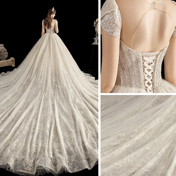 Luxe Champagne Transparentes Robe De Mariée 2020 Robe Boule Encolure Dégagée Manches Courtes Dos Nu Perlage Glitter Tulle Appliques En Dentelle Cathedral Train Volants