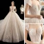 Luxe Champagne Transparentes Robe De Mariée 2020 Robe Boule Encolure Dégagée Manches Courtes Dos Nu Perlage Glitter Tulle Appliques En Dentelle Cathedral Train Volants