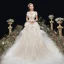 Chic / Belle Champagne La Mariée Robe De Mariée 2020 Princesse Transparentes Col v profond Noeud épaules Sans Manches Dos Nu Appliques En Dentelle Tribunal Train Volants