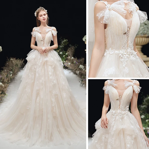 Chic / Belle Champagne La Mariée Robe De Mariée 2020 Princesse Transparentes Col v profond Noeud épaules Sans Manches Dos Nu Appliques En Dentelle Tribunal Train Volants
