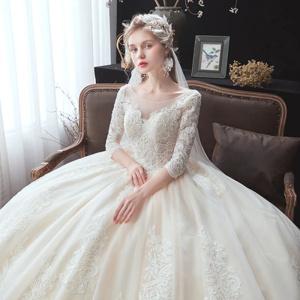 Classic Champagne Winter Wedding Dresses 2020 Ball Gown See-through Scoop Neck 3/4 Sleeve Backless Appliques Lace Beading Cathedral Train Ruffle