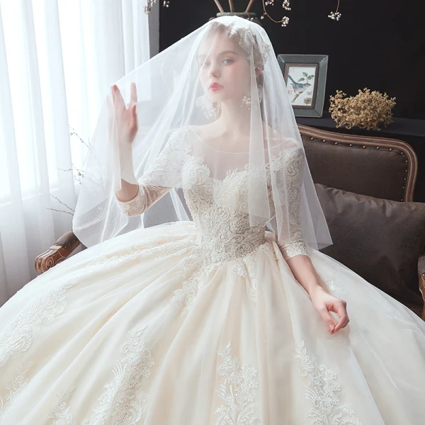Classic Champagne Winter Wedding Dresses 2020 Ball Gown See-through Scoop Neck 3/4 Sleeve Backless Appliques Lace Beading Cathedral Train Ruffle
