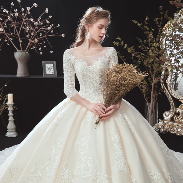Classic Champagne Winter Wedding Dresses 2020 Ball Gown See-through Scoop Neck 3/4 Sleeve Backless Appliques Lace Beading Cathedral Train Ruffle
