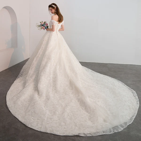Bling Bling Champagne Wedding Dresses 2018 Ball Gown Off-The-Shoulder Short Sleeve Backless Glitter Lace Cathedral Train Ruffle