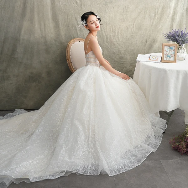 Luxury / Gorgeous Ivory Wedding Dresses 2019 A-Line / Princess Spaghetti Straps Sleeveless Backless Beading Pearl Glitter Tulle Court Train Ruffle