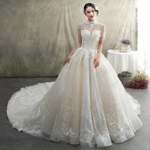 Luxe Champagne Doorzichtige Trouwjurken 2019 Prinses Hoge Kraag Korte Mouwen Ruglooze Appliques Kant Kralen Kwast Glans Tule Cathedral Train Ruche