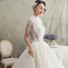 Luxury / Gorgeous Champagne See-through Wedding Dresses 2019 Princess High Neck Short Sleeve Backless Appliques Lace Beading Tassel Glitter Tulle Cathedral Train Ruffle