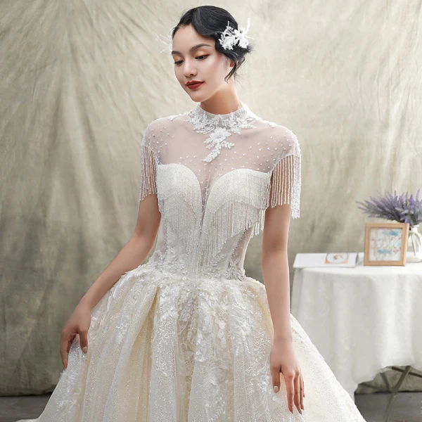 Luxe Champagne Transparentes Robe De Mariée 2019 Princesse Col Haut Manches Courtes Dos Nu Appliques En Dentelle Perlage Gland Glitter Tulle Cathedral Train Volants
