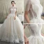 Luxe Champagne Transparentes Robe De Mariée 2019 Princesse Col Haut Manches Courtes Dos Nu Appliques En Dentelle Perlage Gland Glitter Tulle Cathedral Train Volants