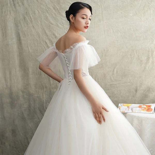 Elegante Ivory / Creme Durchsichtige Brautkleider / Hochzeitskleider 2019 Prinzessin Off Shoulder Kurze Ärmel Rückenfreies Perlenstickerei Sweep / Pinsel Zug Rüschen