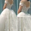 Edles Champagner Durchsichtige Brautkleider / Hochzeitskleider 2019 A Linie Rundhalsausschnitt Kurze Ärmel Rückenfreies Applikationen Spitze Perlenstickerei Kathedrale Schleppe