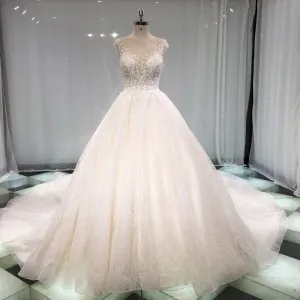 Élégant Champagne Transparentes Robe De Mariée 2019 Princesse Encolure Dégagée Sans Manches Dos Nu Appliques En Dentelle Perle Perlage Glitter Tulle Cathedral Train Volants