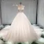 Élégant Champagne Transparentes Robe De Mariée 2019 Princesse Encolure Dégagée Sans Manches Dos Nu Appliques En Dentelle Perle Perlage Glitter Tulle Cathedral Train Volants