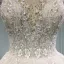 Élégant Champagne Transparentes Robe De Mariée 2019 Princesse Encolure Dégagée Sans Manches Dos Nu Appliques En Dentelle Perle Perlage Glitter Tulle Cathedral Train Volants