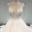Élégant Champagne Transparentes Robe De Mariée 2019 Princesse Encolure Dégagée Sans Manches Dos Nu Appliques En Dentelle Perle Perlage Glitter Tulle Cathedral Train Volants