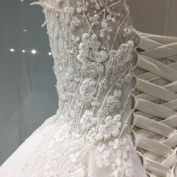 Élégant Champagne Transparentes Robe De Mariée 2019 Princesse Encolure Dégagée Sans Manches Dos Nu Appliques En Dentelle Perle Perlage Glitter Tulle Cathedral Train Volants