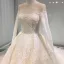 Luxury / Gorgeous Champagne See-through Wedding Dresses 2019 Princess Scoop Neck Long Sleeve Backless Appliques Lace Pearl Beading Glitter Tulle Cathedral Train Ruffle