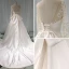 Élégant Ivoire Satin Transparentes Robe De Mariée 2019 Princesse Encolure Dégagée Percé Manches Longues Dos Nu Noeud Appliques En Dentelle Perlage Chapel Train Volants