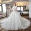 Luxe Ivoire Transparentes Robe De Mariée 2019 Robe Boule Col Haut Manches Courtes Dos Nu Perlage Gland Appliques En Dentelle Glitter Tulle Cathedral Train Volants