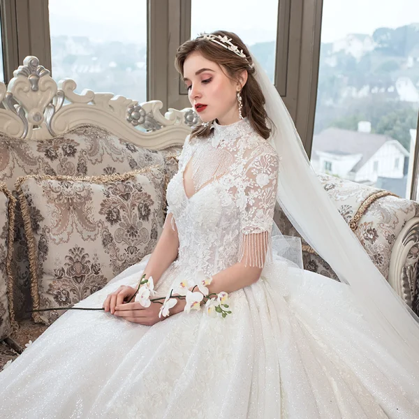Luxe Ivoire Transparentes Robe De Mariée 2019 Robe Boule Col Haut Manches Courtes Dos Nu Perlage Gland Appliques En Dentelle Glitter Tulle Cathedral Train Volants