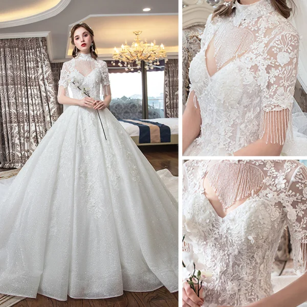 Luxe Ivoire Transparentes Robe De Mariée 2019 Robe Boule Col Haut Manches Courtes Dos Nu Perlage Gland Appliques En Dentelle Glitter Tulle Cathedral Train Volants