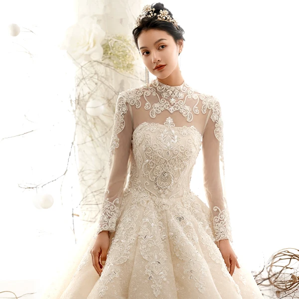 Vintage / Originale Champagne Transparentes Robe De Mariée 2019 Princesse Col Haut Manches Longues Forme de coeur Dos Nu Appliques En Dentelle Perlage Cathedral Train Volants