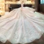 Elegante Ivory / Creme Durchsichtige Brautkleider / Hochzeitskleider 2019 A Linie Rundhalsausschnitt Lange Ärmel Rückenfreies Perlenstickerei Glanz Tülle Kapelle-Schleppe Rüschen