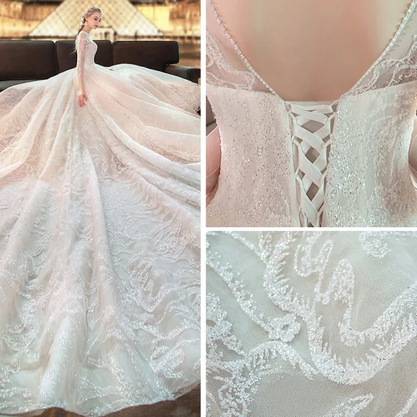 Elegante Ivory / Creme Durchsichtige Brautkleider / Hochzeitskleider 2019 A Linie Rundhalsausschnitt Lange Ärmel Rückenfreies Perlenstickerei Glanz Tülle Kapelle-Schleppe Rüschen