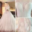Elegante Ivory / Creme Durchsichtige Brautkleider / Hochzeitskleider 2019 A Linie Rundhalsausschnitt Lange Ärmel Rückenfreies Perlenstickerei Glanz Tülle Kapelle-Schleppe Rüschen