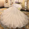 Sparkly Champagne See-through Wedding Dresses 2019 Ball Gown Scoop Neck Long Sleeve Backless Glitter Sequins Cathedral Train Ruffle