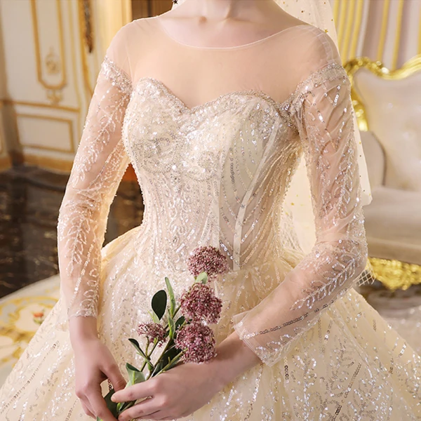 Sparkly Champagne See-through Wedding Dresses 2019 Ball Gown Scoop Neck Long Sleeve Backless Glitter Sequins Cathedral Train Ruffle