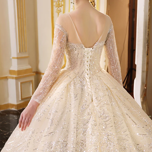 Sparkly Champagne See-through Wedding Dresses 2019 Ball Gown Scoop Neck Long Sleeve Backless Glitter Sequins Cathedral Train Ruffle