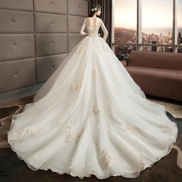 Illusion Ivoire Transparentes Robe De Mariée 2019 Princesse Encolure Carrée Manches Longues Dos Nu Appliques En Dentelle Perlage Glitter Tulle Cathedral Train Volants