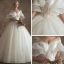Elegante Ivory / Creme Durchsichtige Brautkleider / Hochzeitskleider 2019 A Linie V-Ausschnitt Glockenhülsen Rückenfreies Applikationen Spitze Perlenstickerei Kapelle-Schleppe Rüschen