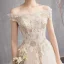 Abordable Champagne Robe De Mariée 2019 Princesse De l'épaule Manches Courtes Dos Nu En Dentelle Appliques Chapel Train Volants