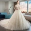 Élégant Champagne Transparentes Robe De Mariée 2019 Princesse Encolure Dégagée Manches Longues Dos Nu Cristal Perlage Appliques En Dentelle Cathedral Train Volants
