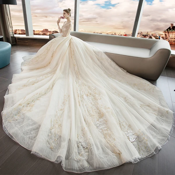 Élégant Champagne Transparentes Robe De Mariée 2019 Princesse Encolure Dégagée Manches Longues Dos Nu Cristal Perlage Appliques En Dentelle Cathedral Train Volants