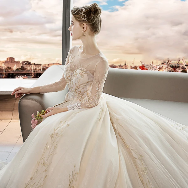 Élégant Champagne Transparentes Robe De Mariée 2019 Princesse Encolure Dégagée Manches Longues Dos Nu Cristal Perlage Appliques En Dentelle Cathedral Train Volants