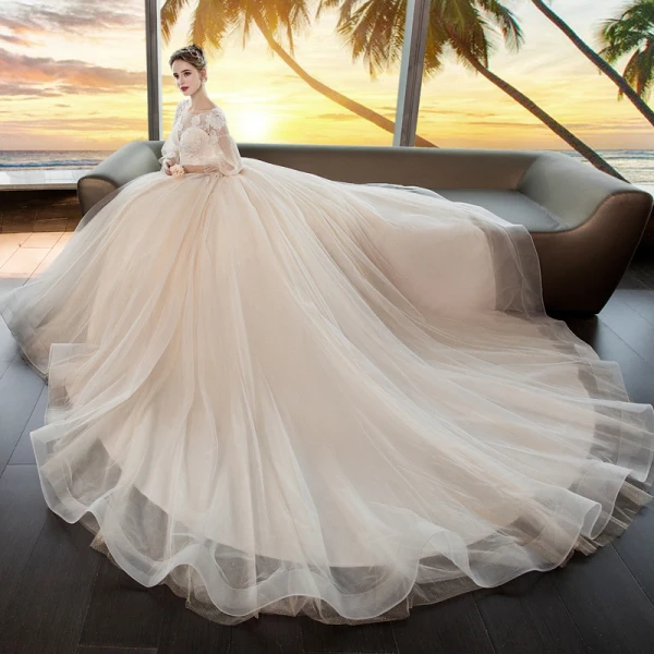 Romantique Champagne Transparentes Robe De Mariée 2019 Princesse Encolure Dégagée Gonflée 3/4 Manches Dos Nu Appliques En Dentelle Perlage Cristal Glitter Tulle Chapel Train Volants