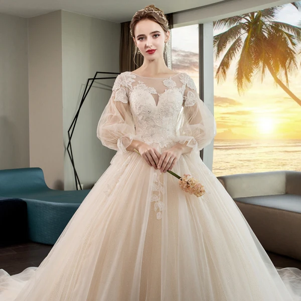 Romantique Champagne Transparentes Robe De Mariée 2019 Princesse Encolure Dégagée Gonflée 3/4 Manches Dos Nu Appliques En Dentelle Perlage Cristal Glitter Tulle Chapel Train Volants
