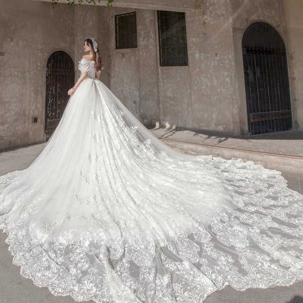 Étourdissant Ivoire Robe De Mariée 2019 Princesse De l'épaule Gonflée Manches Courtes Dos Nu Appliques En Dentelle Tulle Glitter Royal Train Volants
