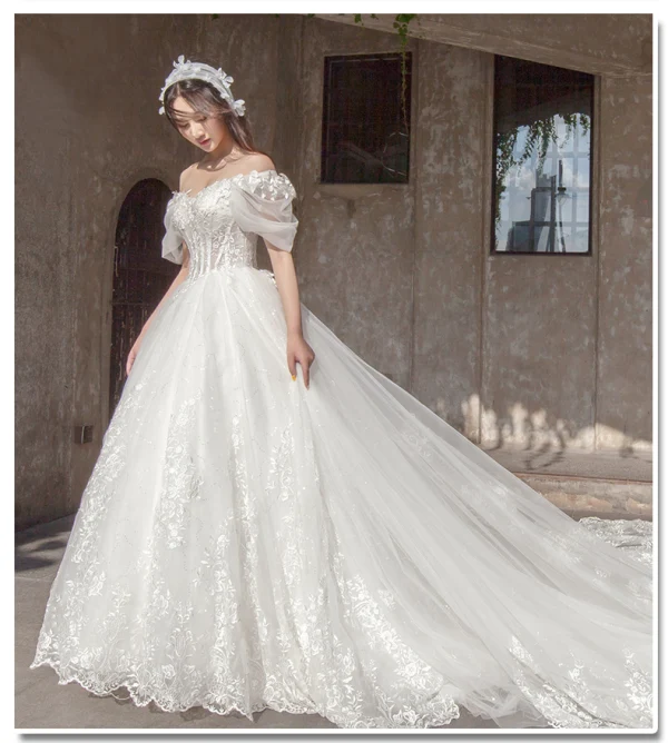 Étourdissant Ivoire Robe De Mariée 2019 Princesse De l'épaule Gonflée Manches Courtes Dos Nu Appliques En Dentelle Tulle Glitter Royal Train Volants