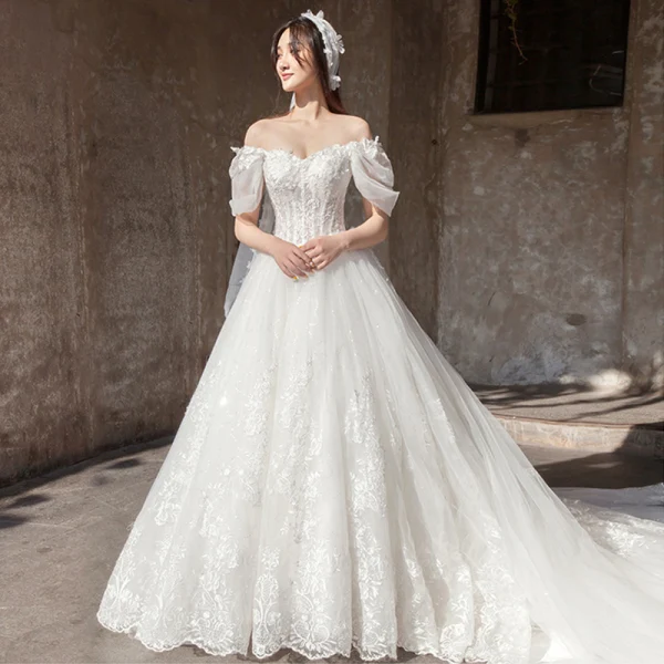 Étourdissant Ivoire Robe De Mariée 2019 Princesse De l'épaule Gonflée Manches Courtes Dos Nu Appliques En Dentelle Tulle Glitter Royal Train Volants