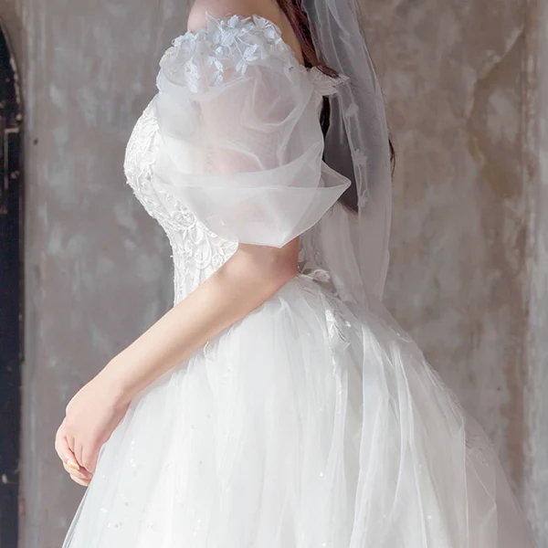 Étourdissant Ivoire Robe De Mariée 2019 Princesse De l'épaule Gonflée Manches Courtes Dos Nu Appliques En Dentelle Tulle Glitter Royal Train Volants