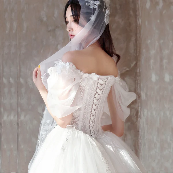 Étourdissant Ivoire Robe De Mariée 2019 Princesse De l'épaule Gonflée Manches Courtes Dos Nu Appliques En Dentelle Tulle Glitter Royal Train Volants