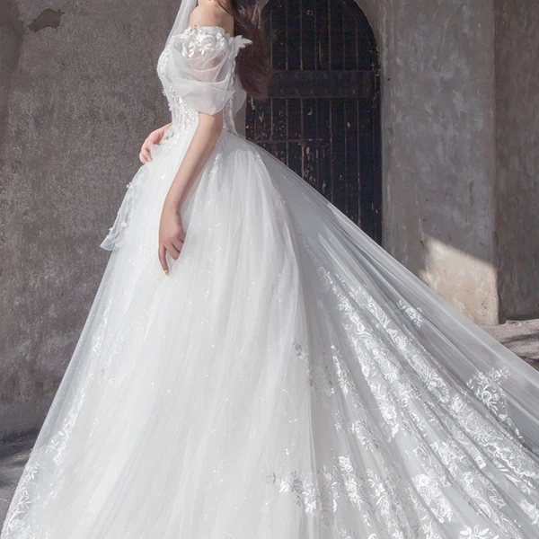 Étourdissant Ivoire Robe De Mariée 2019 Princesse De l'épaule Gonflée Manches Courtes Dos Nu Appliques En Dentelle Tulle Glitter Royal Train Volants