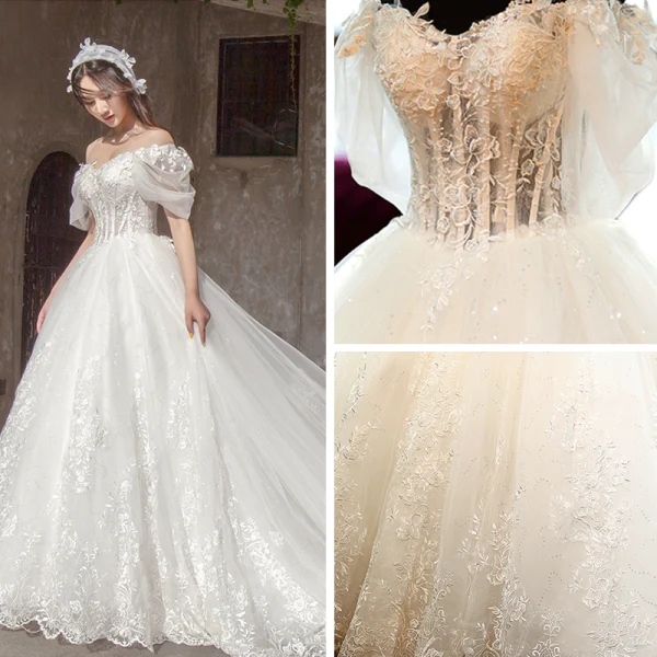 Étourdissant Ivoire Robe De Mariée 2019 Princesse De l'épaule Gonflée Manches Courtes Dos Nu Appliques En Dentelle Tulle Glitter Royal Train Volants